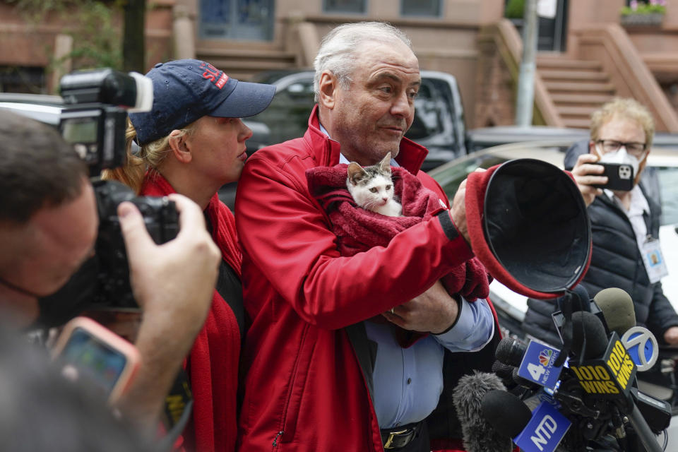 Mayoral candidate Curtis Sliwa takes off his beret as he talks to reporters before voting in New York, Tuesday, Nov. 2, 2021. (AP Photo/Seth Wenig)