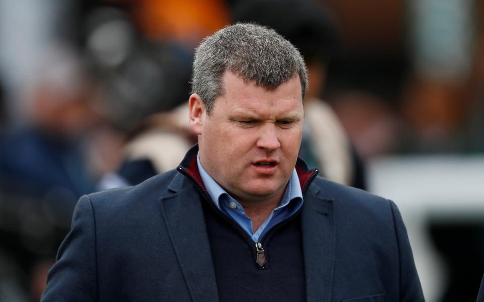 The ban came after the 'unforgivable' photograph of Gordon Elliott sitting on a dead horse came to light  - REUTERS