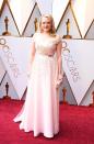 <p>Elisabeth Moss stuns in an off-the-shoulder white beaded gown designed by Christian Dior.</p>