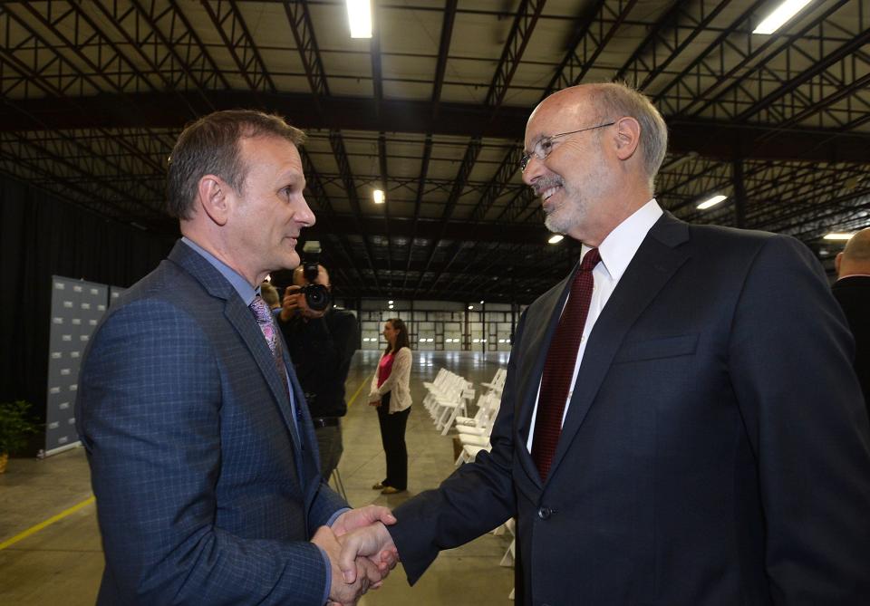 UPMC Hamot President David Gibbons, left, shown in a 2017 file photo with then Gov. Tom Wolf, has been promoted to regional president of UPMC's Health Services Division. UPMC will conduct a national search for Hamot's next president.