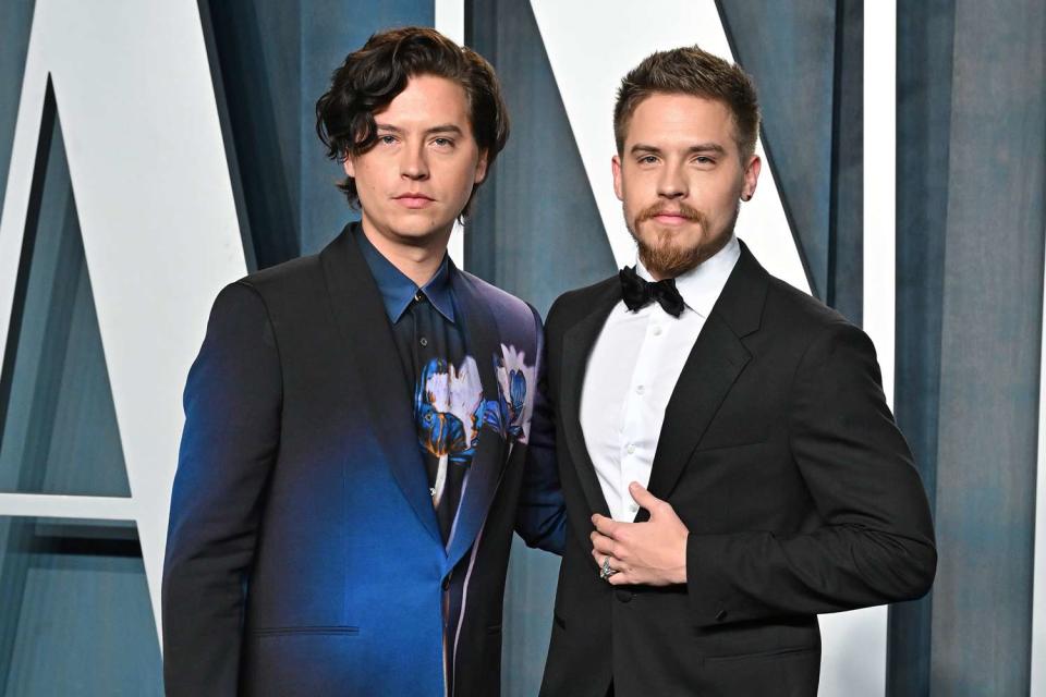 <p>Axelle/Bauer-Griffin/FilmMagic</p> Cole Sprouse and Dylan Sprouse are pictured attending the 2022 Vanity Fair Oscar Party on March 27, 2022 in Beverly Hills, California.