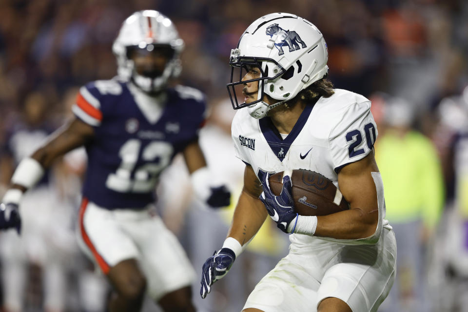 Samford running back Jay Stanton (20) carries the ball against Auburn during the first half of an NCAA college football game Saturday, Sept. 16, 2023, in Auburn, Ala. (AP Photo/Butch Dill)