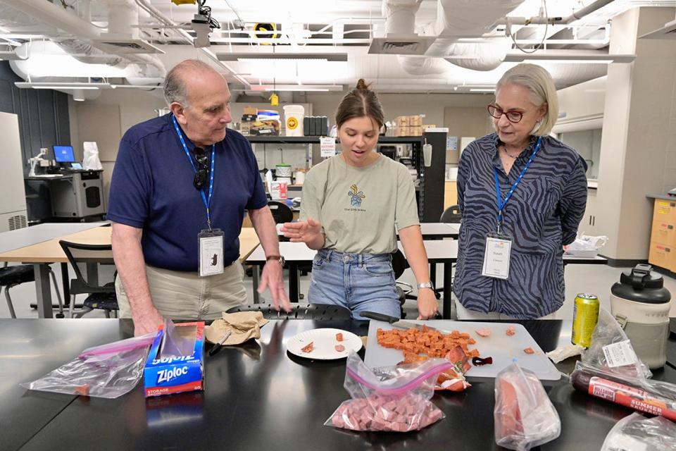 MTSU first-year graduate student Elizabeth Zuy, center, provides a brief demonstration of the fermentation of meats for Alumni Summer College attendees Bob, left, and Susan Cimino of Wylie, Texas. Bob Cimino (Class of 1967) earned a bachelor’s degree, with a double major in math and industrial studies.