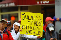 <p>People hold up a placard to support a friend running in the 2017 New York City Marathon, Nov. 5, 2017. (Photo: Gordon Donovan/Yahoo News) </p>