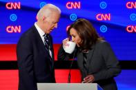 FILE PHOTO: Former Vice President Biden approaches U.S. Senator Harris during a commercial break on the second night of the second U.S. 2020 presidential Democratic candidates debate in Detroit