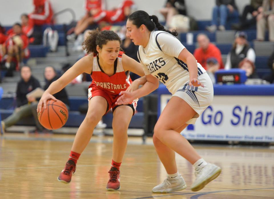 Monomoy's Melissa Velasquez, right, tries to block Barnstable's Joslin Cabral in a second quarter play on Jan. 10.