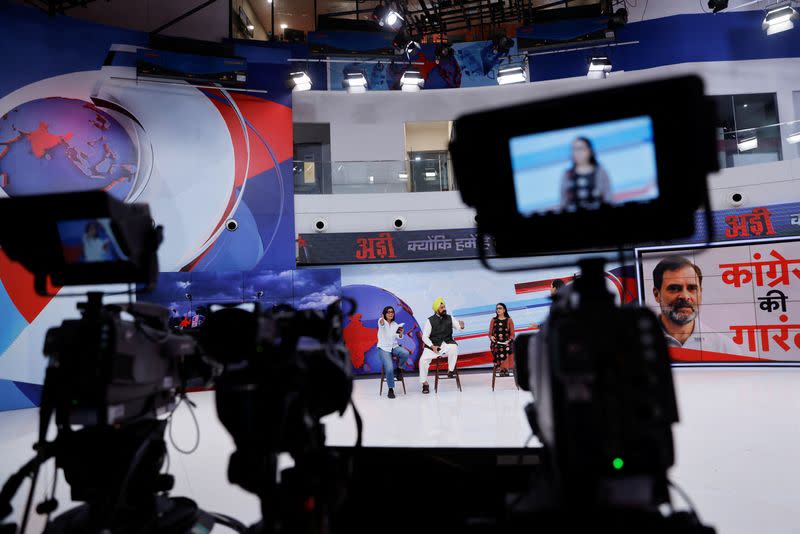 Neha Singh Rathore, 27, a folk singer and social media content creator, reacts during a debate where she was asked to be a panelist, inside the studio of a national television news network in Noida