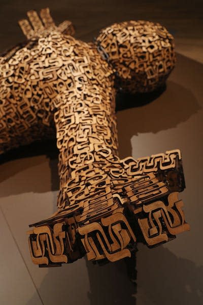 A sculpture of the golem made up of carvings of Jewish letters, by artist Joshua Abarbanel and displayed in the Jewish Museum in Berlin. <a href="https://www.gettyimages.com/detail/news-photo/sculpture-of-the-golem-by-artist-joshua-abarbanel-lies-in-news-photo/609667830?adppopup=true" rel="nofollow noopener" target="_blank" data-ylk="slk:Sean Gallup/Getty Images;elm:context_link;itc:0;sec:content-canvas" class="link ">Sean Gallup/Getty Images</a>