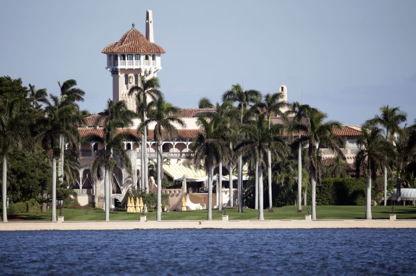 FILE- This Monday, Nov. 21, 2016 file photo, shows the Mar-a-Lago resort owned by President-elect Donald Trump in Palm Beach, Fla. Three teenagers are facing felony charges after police said Wednesday, Aug. 5, 2020, they jumped a wall at President Donald Trump's Mar-a-Lago club while fleeing officers. Police say the three were carrying a semi-automatic gun in a backpack, but likely didn't know the wall belonged to Mar-a-Lago. Neither the president nor a family member was at the club, which is closed for the summer. (AP Photo/Lynne Sladky, File)