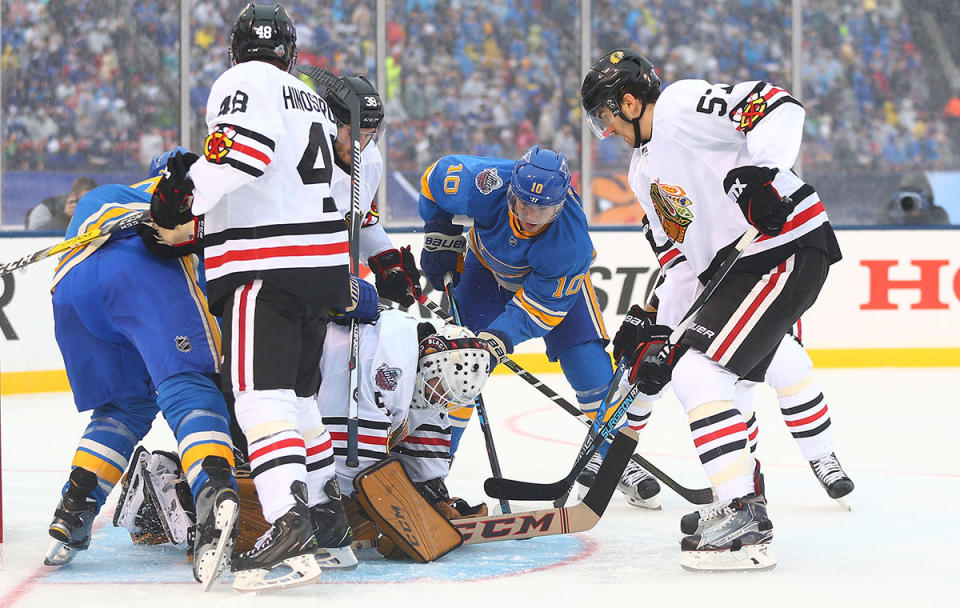 <p>ST. LOUIS, MO – JANUARY 2: Corey Crawford #50 of the Chicago Blackhawks makes a save against Scottie Upshall #10 of the St. Louis Blues during the 2017 Bridgestone NHL Winter Classic at Busch Stadium on January 2, 2017 in St. Louis, Missouri. (Photo by Dilip Vishwanat/Getty Images) </p>