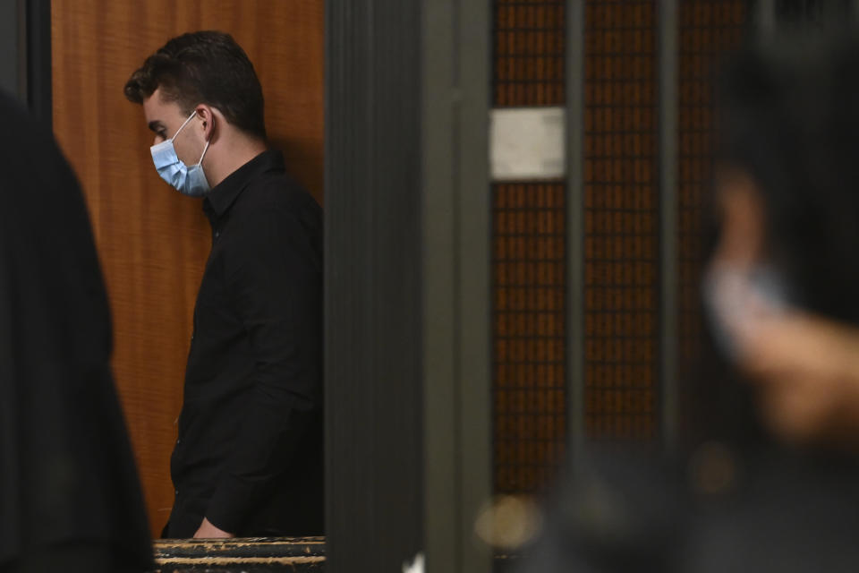 Gabriel Natale Hjorth, from the United States, center, leaves the courtroom where he stood trial for the killing of Italian Carabinieri police officer Mario Cerciello Rega, in Rome, Wednesday, July 22, 2020. Two tourists from California are accused of murdering Cerciello during their summer vacation in Italy in July 2019. (Andreas Solaro/Pool via AP)