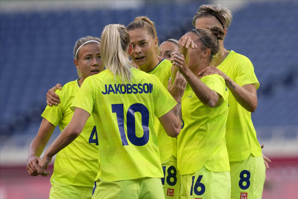 Sweden's players gather during a women's soccer match against Australia at the 2020 Summer Olympics, Saturday, July 24, 2021, in Saitama, Japan. (AP Photo/Martin Mejia)