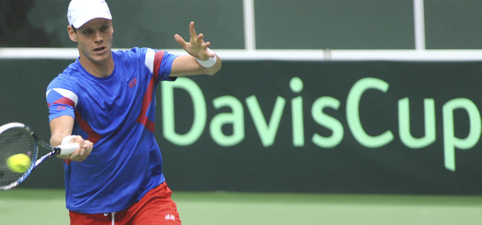 Tomas Berdych from the Czech Republic returns the ball to Igor Sijsling from the Netherlands during their Davis Cup first round singles match in Ostrava, Czech Republic, Friday, Jan. 31, 2014. (AP Photo,CTK/Jaroslav Ozana) SLOVAKIA OUT