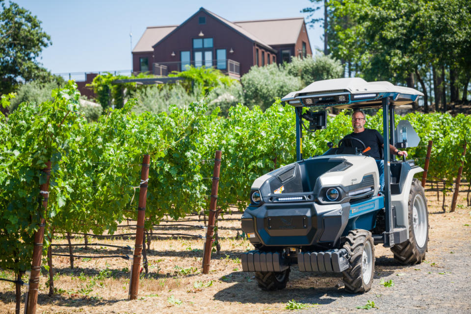 Winemaker Sam Kaplan in the estate's Monarch tractor<p>Courtesy of Arkenstone | Photo by Jak Wonderly</p>