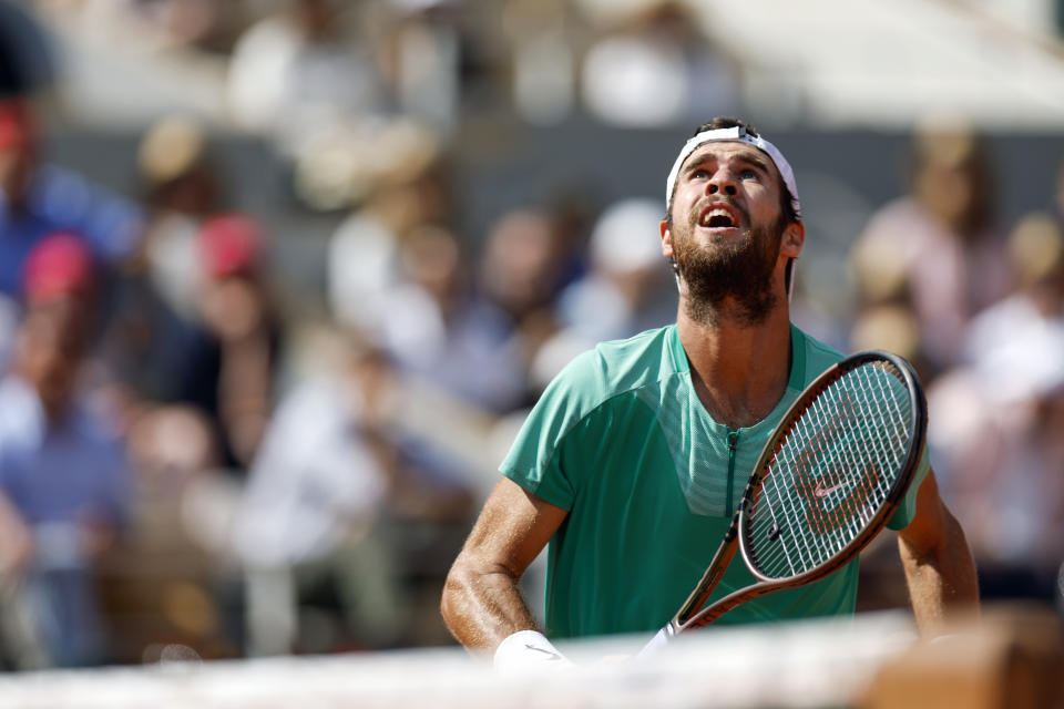 Russia's Karen Khachanov eyes the ball as he prepares to play a shot against Serbia's Novak Djokovic during their quarter final match of the French Open tennis tournament at the Roland Garros stadium in Paris, Tuesday, June 6, 2023. (AP Photo/Jean-Francois Badias)