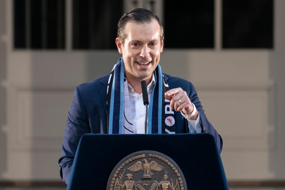 New York City FC's CEO Brad Sims speaks to the audience during a ceremony to honor the team's MLS championship win, Tuesday, Dec. 14, 2021, in New York. New York City FC won via a shootout following a 1-1 draw on Dec. 11. (AP Photo/John Minchillo)