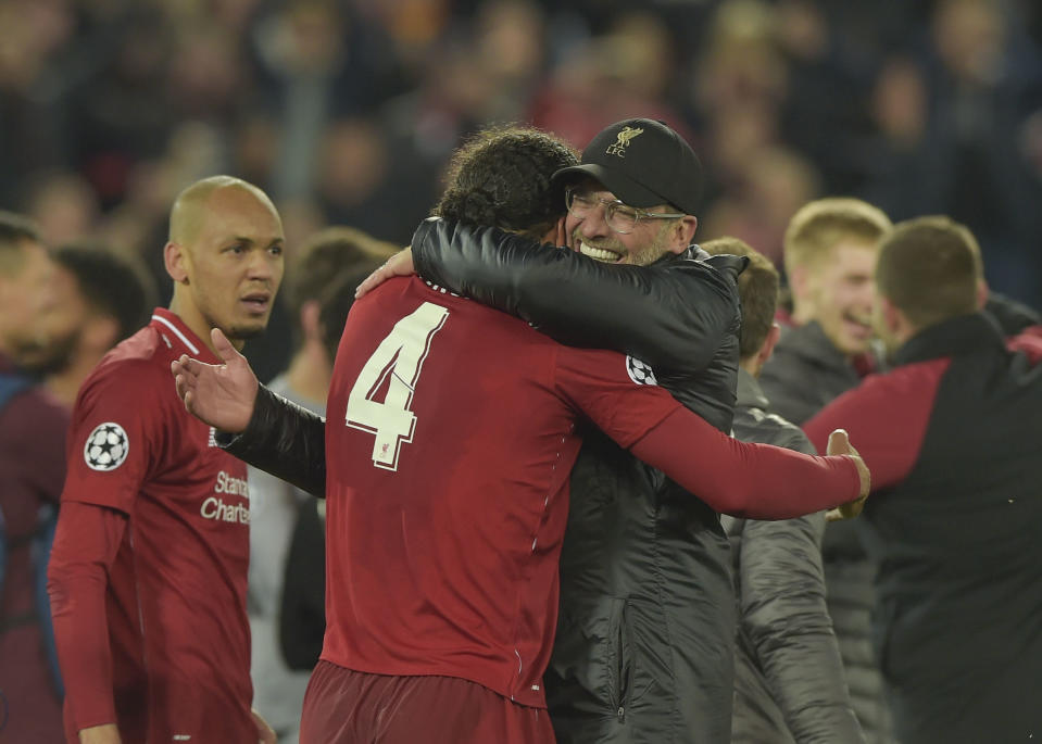 Klopp celebrates with Virgil Van Dijk and Fabinho