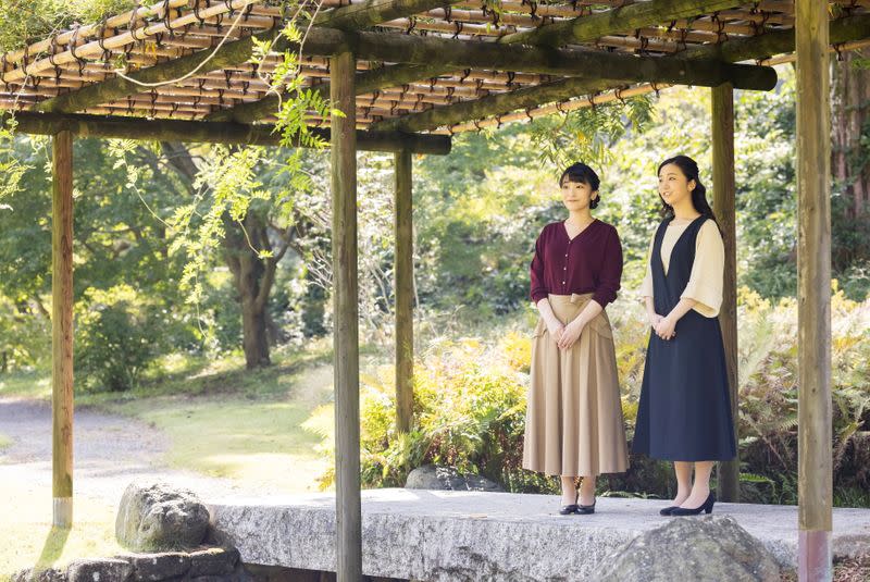 Japan's Princess Mako, the daughter of Crown Prince Akishino and Crown Princess Kiko, strolls with her younger sister Princess Kako at the garden in Tokyo