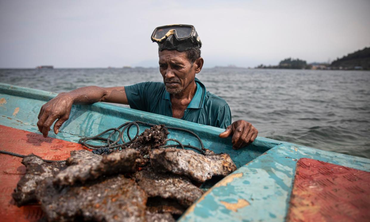 <span>Upin collects scrap metal from the ocean floor. Since factories opened next to his home in Morowali, fish are no longer abundant and he has had to find other ways to make a living.</span><span>Photograph: Per Elinder Liljas</span>