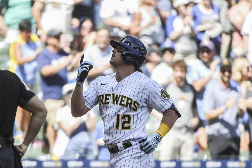 Milwaukee Brewers' Hunter Renfroe makes it to home plate after his home run during the third inning of a baseball game against the Colorado Rockies, Sunday, July 24, 2022, in Milwaukee. (AP Photo/Kenny Yoo)