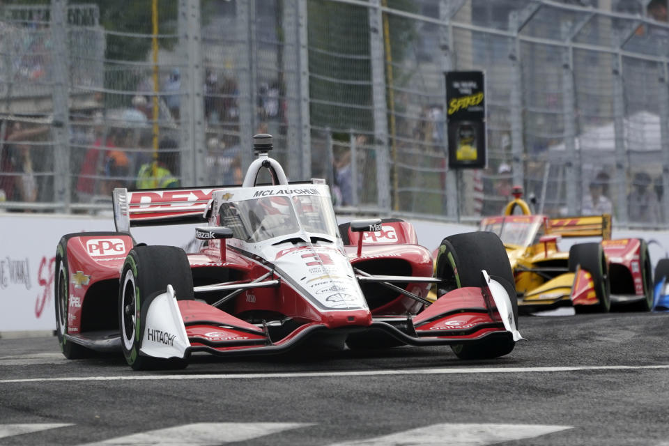 Scott McLaughlin (3) comes through a turn during the Music City Grand Prix auto race Sunday, Aug. 7, 2022, in Nashville, Tenn. (AP Photo/Mark Humphrey)