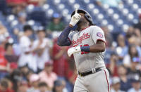 Washington Nationals' Josh Bell gestures after hitting a three-run home run during the first inning of the team's baseball game against the Philadelphia Phillies, Tuesday, July 27, 2021, in Philadelphia. (AP Photo/Laurence Kesterson)