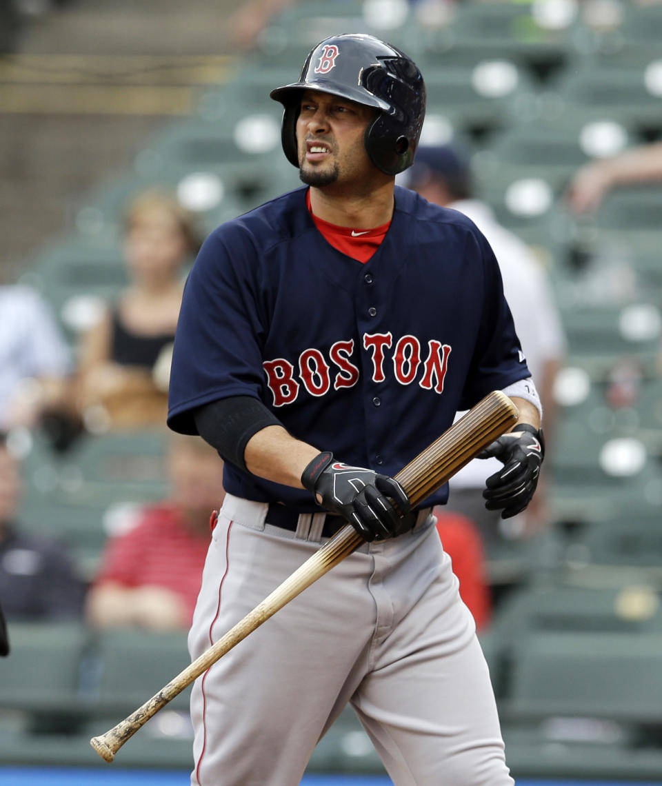 Boston Red Sox's Shane Victorino looks back at the mound after striking out against Texas Rangers' Yu Darvish in the first inning of a baseball game, Friday, May 9, 2014, in Arlington, Texas. (AP Photo/Tony Gutierrez)