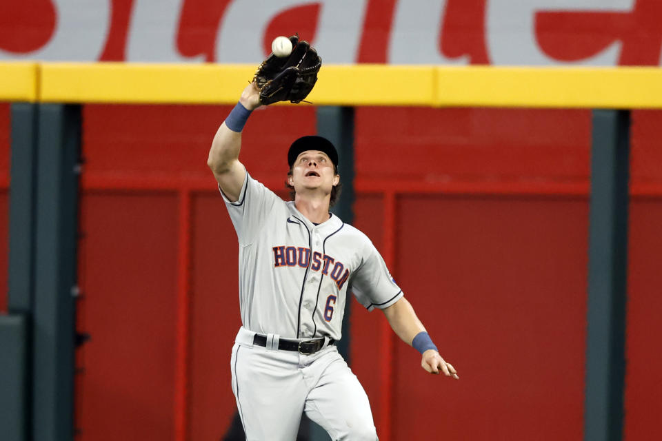 Houston Astros center fielder Jake Meyers catches a fly ball for the out on Atlanta Braves' Matt Olson to secure the win against the Atlanta Braves during the ninth inning of a baseball game, Friday, April 21, 2023, in Atlanta. Houston Astros won 6-4. (AP Photo/Butch Dill)