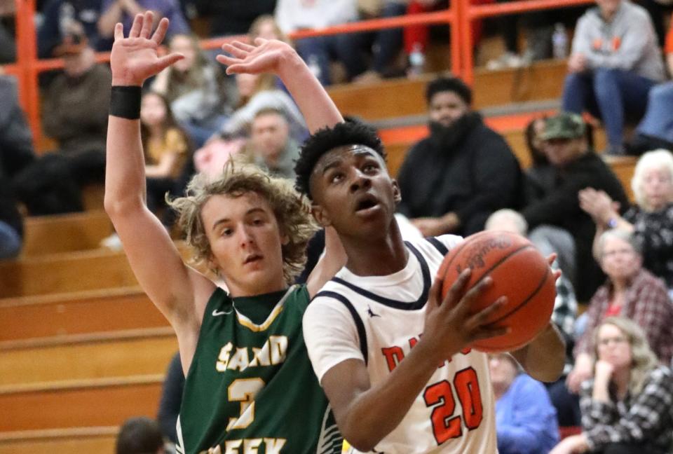 Jha Jha Hornbeak goes to the basket during a 62-54 win over Sand Creek Friday night.