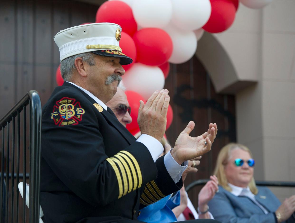 Fire-Rescue Chief Donatto applauds during the Palm Beach Public Safety Day and Fire Department Centennial Celebration on Dec. 11. The event was a celebration of 100 years of the Palm Beach Fire-Rescue Department.