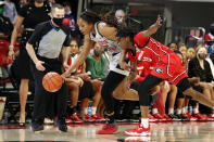 North Carolina State's Kayla Jones (25) takes the ball away from Georgia's Que Morrison (23) during the second half of an NCAA college basketball game, Thursday, Dec. 16, 2021, in Raleigh, N.C. (AP Photo/Karl B. DeBlaker)