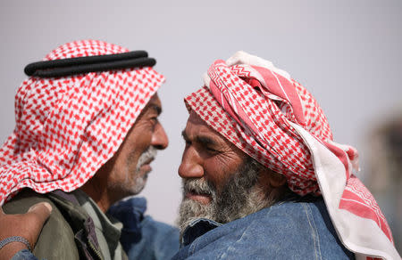 Relatives of victims of the car bomb attack react in Hasaka province, Syria, October 13, 2017. REUTERS/Rodi Said