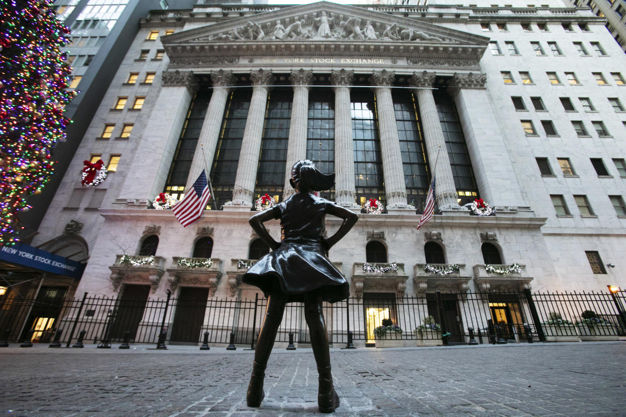 The Fearless Girl statue stands at its new location in front of the New York Stock Exchange, Tuesday, Dec. 11, 2018. (AP Photo/Mark Lennihan)