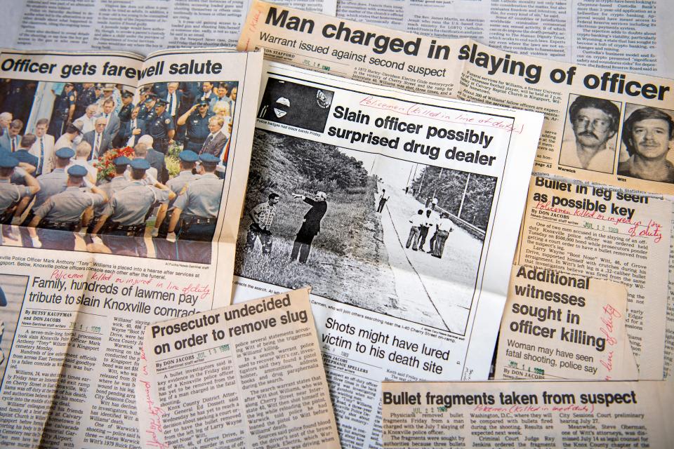 Newspaper clippings from the News Sentinel's coverage of the 1989 death of Knoxville police officer Mark Anthony "Tony" Williams are photographed on Friday, February 9, 2024.