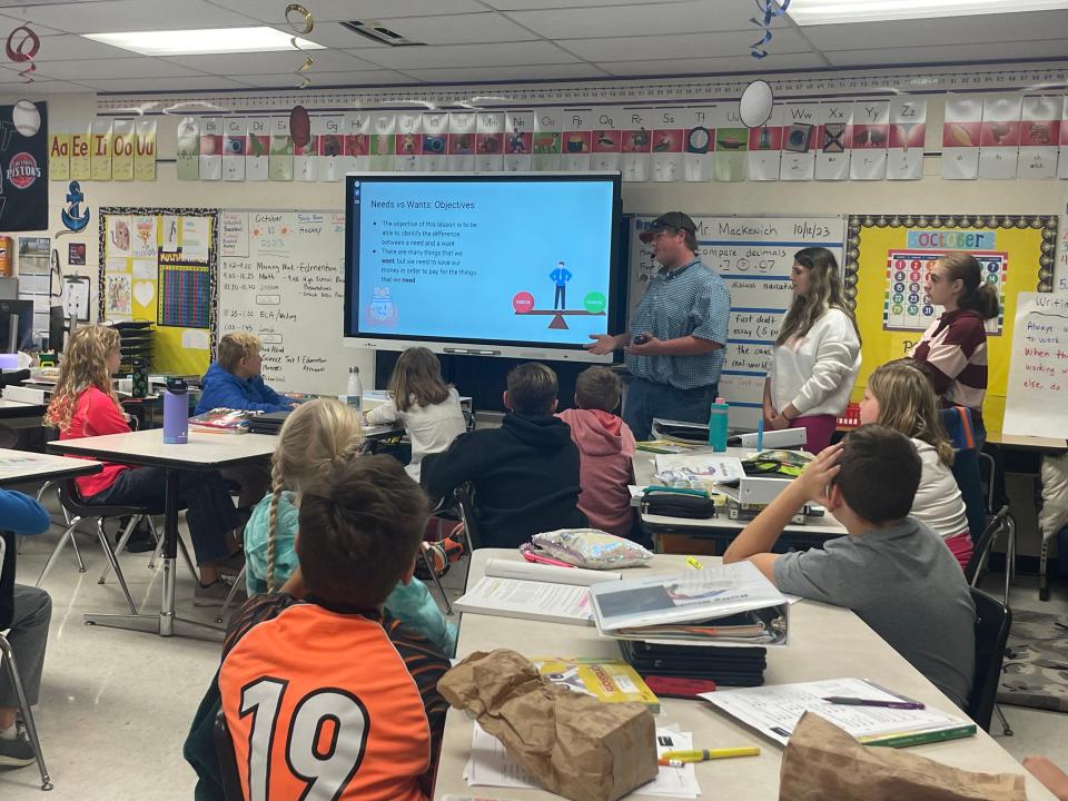 Marine City High School students teaches financial skills to fifth graders at Belle River Elementary School on Oct. 12, 2023.