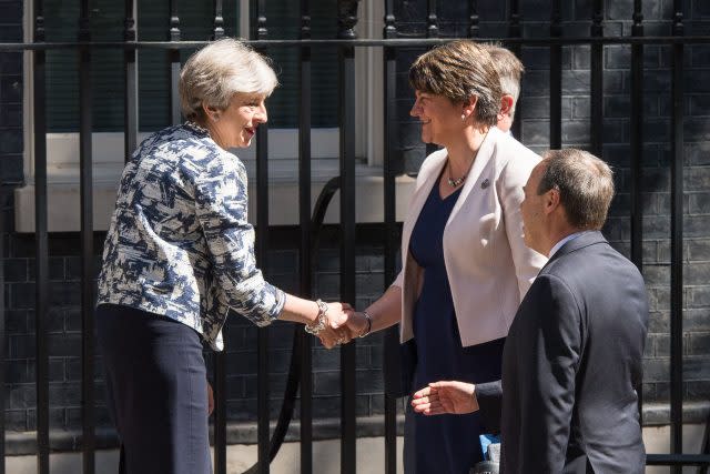 Theresa May greets DUP leader Arlene Foster, DUP deputy leader Nigel Dodds and DUP MP Sir Jeffrey Donaldson