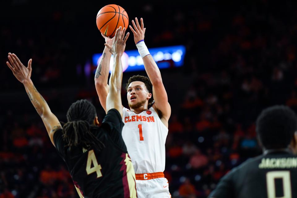 Clemson junior guard Chase Hunter (1) shoots the ball over Florida State University guard Caleb Mills (4) during the second half of a game that resulted in a 94-54 win against Florida State University at Littlejohn Coliseum in Clemson, S.C. Wednesday, Feb. 15, 2023. 