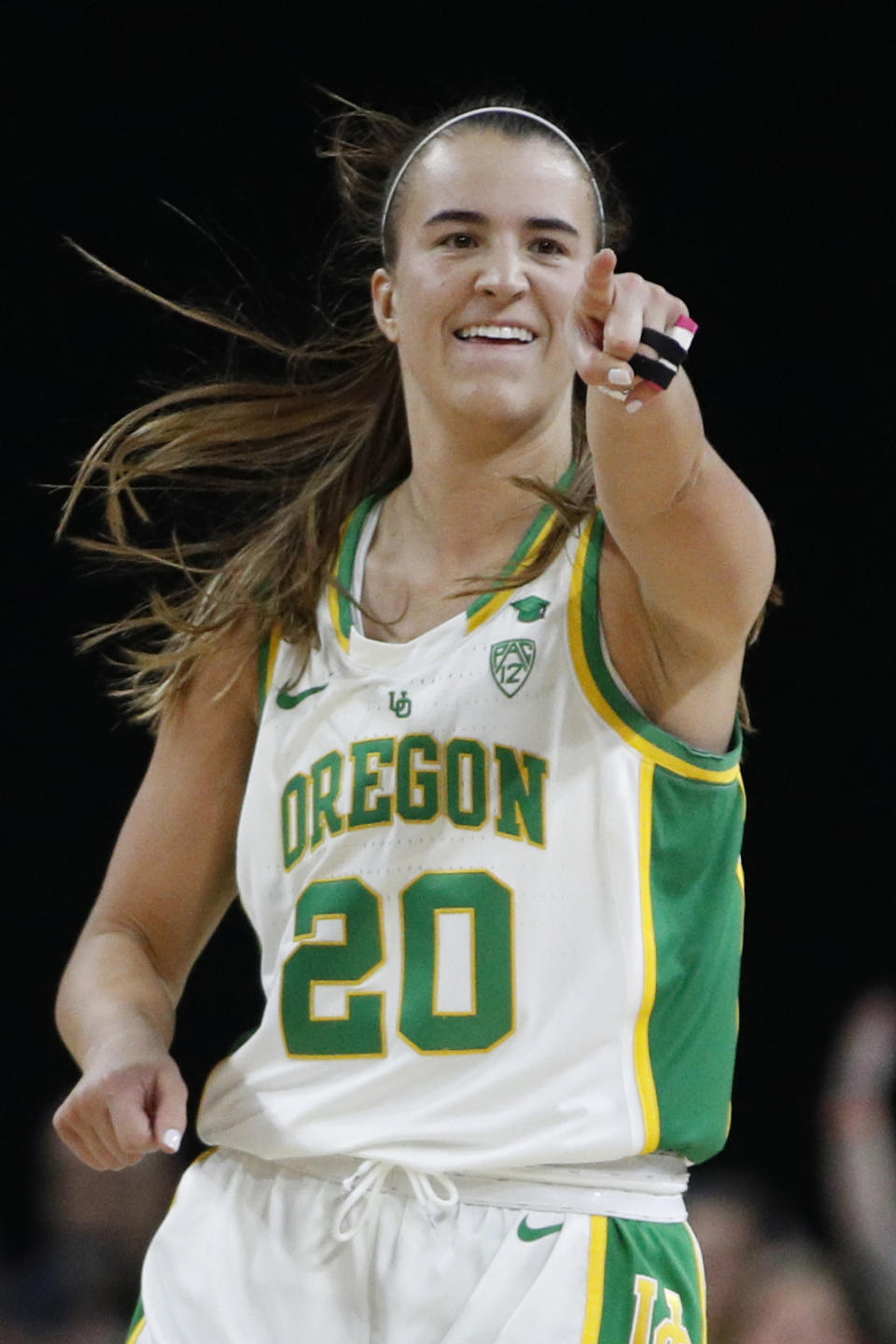 FILE - In this March 8, 2020, file photo, Oregon's Sabrina Ionescu (20) reacts after her team scored against Stanford during the second half of an NCAA college basketball game in the final of the Pac-12 women's tournament in Las Vegas. Ionescu is among the athletes who will help young girls and women stay mentally and physically fit during the coronavirus pandemic. The Women’s Sports Foundation and Yahoo Sports are launching #WeKeepPlaying, a live-stream event on Saturday at 4 p.m. EDT. (AP Photo/John Locher, File)