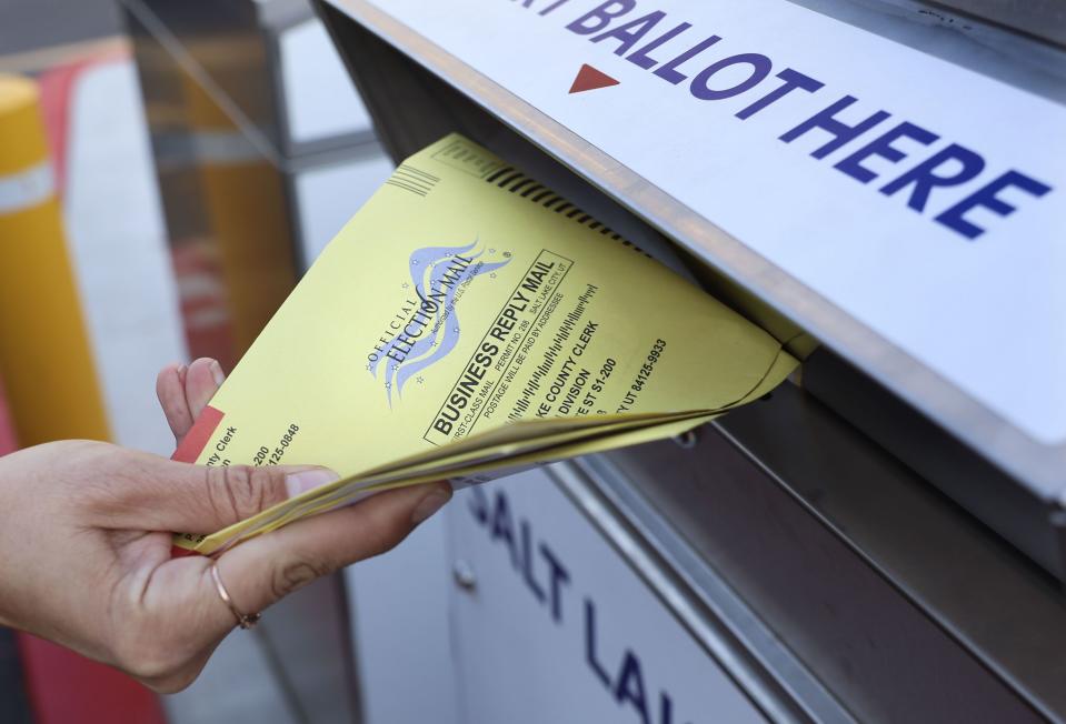 A voter places her ballot into a secure ballot drop box at the Salt Lake County Government Center in Salt Lake City on Wednesday, Nov. 21, 2023. | Laura Seitz, Deseret News