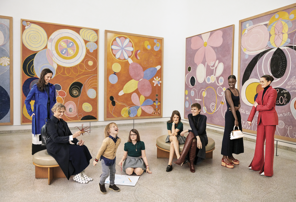 “We have a responsibility now to do much more,” Hearst says. “We have to be ambassadors of the true American spirit!”
Hearst (seated, wearing brown boots) surrounded by friends and collaborators—and (to her left) her three children, Jack, Mia, and Olivia—at the Solomon R. Guggenheim Museum in Manhattan.