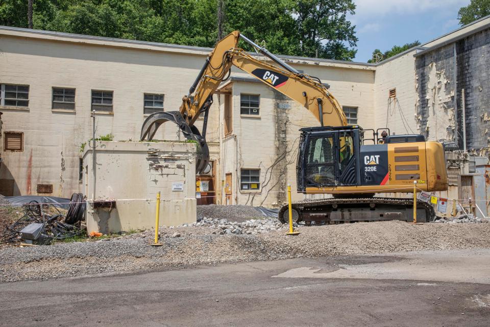 Crews began demolishing the Criticality Experiment Laboratory on the Oak Ridge Reservation by removing some of the auxiliary facilities surrounding the main building.