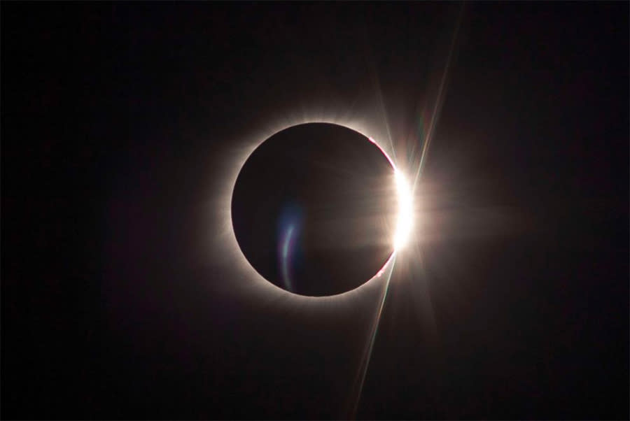 The “diamond ring” moment, where the sun begins to peek out again as the moon moves on. And again: Imagine the sky deep blue, not black. (abcnews.com)