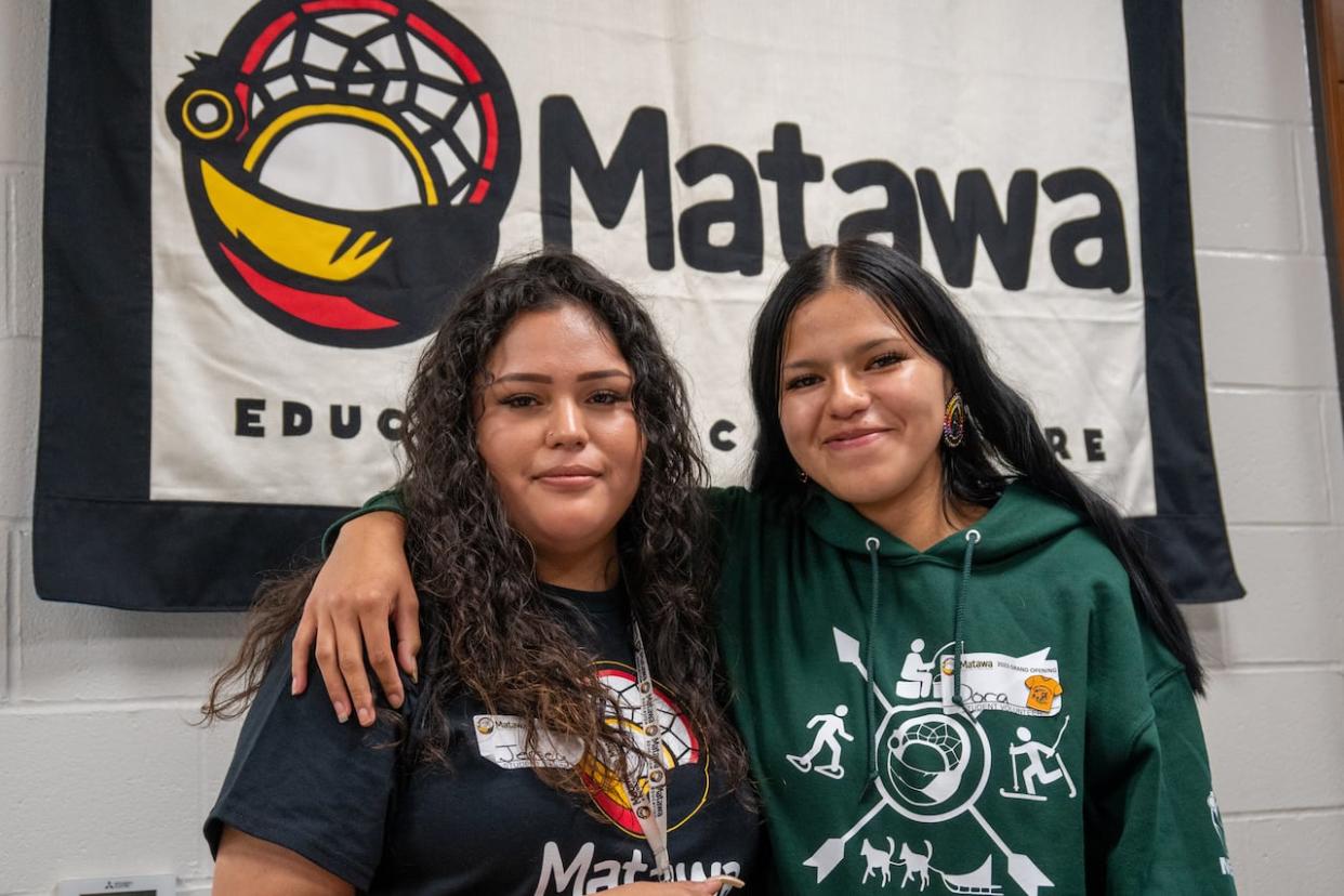 Jersey Towegishig and Dora Ooshag, left to right, attend the Matawa Education and Care Centre in Thunder Bay, Ont. The centre held a grand opening ceremony on Friday to mark the completion of construction and renovations at the building. (Sarah Law/CBC - image credit)