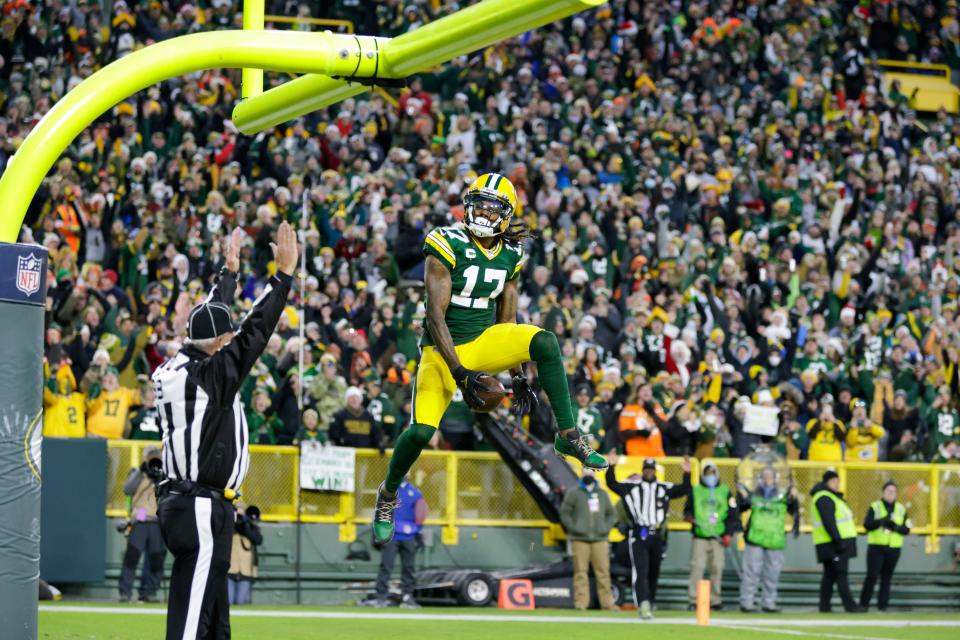 Green Bay Packers' Davante Adams celebrates his touchdown catch during the first half of an NFL football game against the Cleveland Browns Saturday, Dec. 25, 2021, in Green Bay, Wis. (AP Photo/Matt Ludtke)