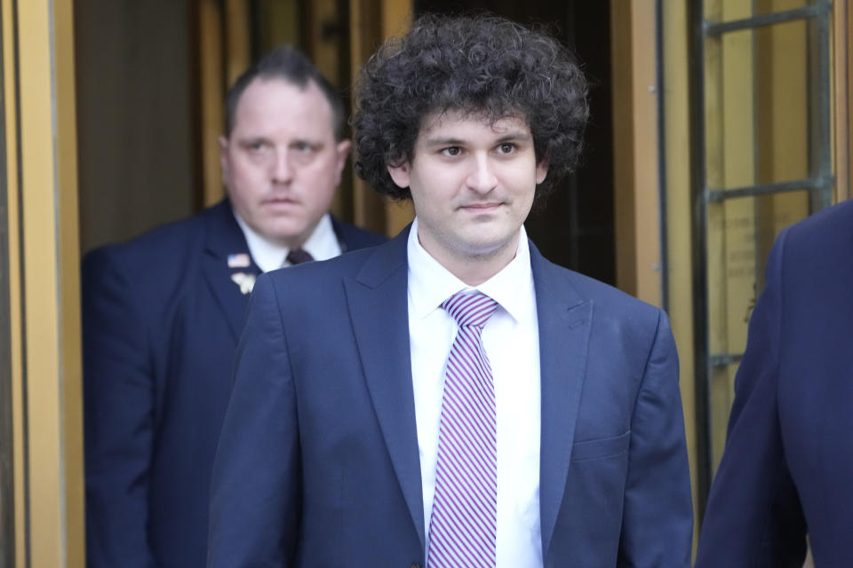 FILE - FTX founder Sam Bankman-Fried leaves Federal court, Wednesday, July 26, 2023, in New York. The Associated Press reported on stories circulating online incorrectly claiming the Department of Justice has dropped all charges against FTX founder Sam Bankman-Fried, who is accused of cheating investors and looting customer deposits on the cryptocurrency trading platform. (AP Photo/Mary Altaffer, File)