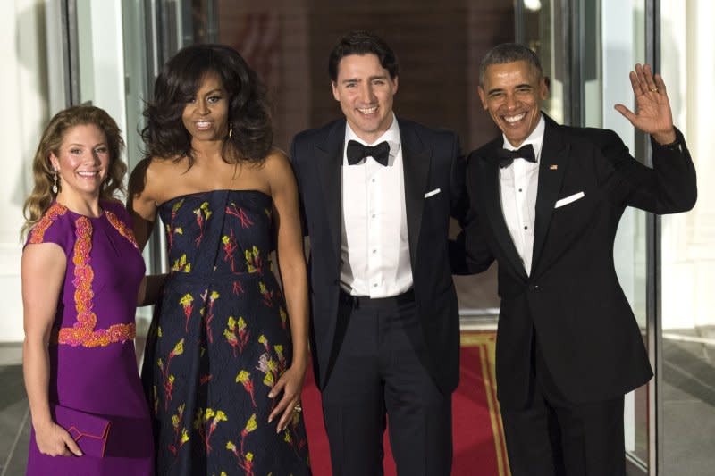 President Barack Obama (R) and First Lady Michelle Obama (2nd-L), Canadian Prime Minister Justin Trudeau (2nd-R) and his wife Sophie Gregoire Trudeau pose as they arrive for a State Dinner at the White House in March 2016. File Photo by Kevin Dietsch/UPI