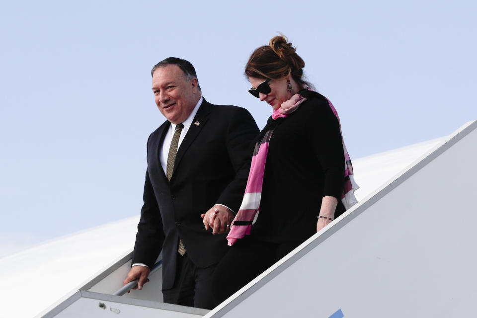 U.S. Secretary of State Mike Pompeo, left, arrives with his wife Susan Pompeo, right, at the airport in Prague, Czech Republic, Tuesday, Aug. 11, 2020. U.S. Secretary of State Mike Pompeo is in Czech Republic at the start of a four-nation tour of Europe. Slovenia, Austria and Poland the other stations of the trip. (AP Photo/Petr David Josek, Pool)