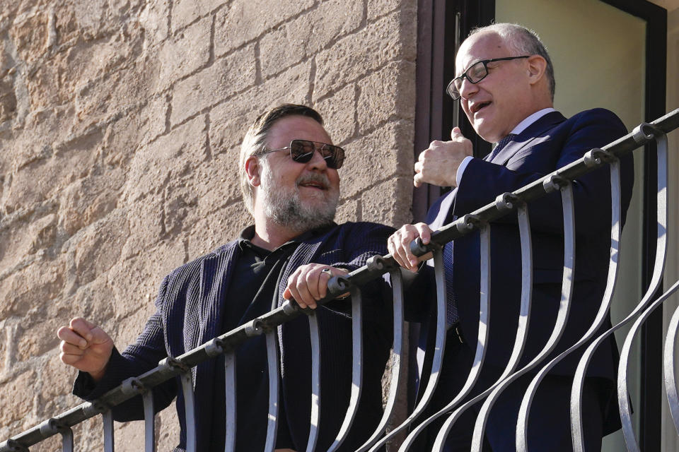 Actor Russel Crowe, left, and Rome's mayor Roberto Gualtieri talk on the terrace of the mayor's studio, prior to the "Ambassador of Rome in the World" award ceremony, in Rome's Capitol Hill, Friday, Oct. 14, 2022. (AP Photo/Andrew Medichini)