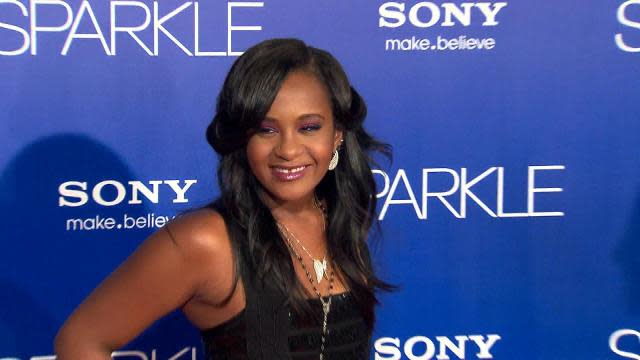 Bobbi Kristina Brown, the daughter of late music legend Whitney Houston and R&B singer Bobby Brown, died on July 26, surrounded by her family, at Peachtree Christian Hospice in Duluth, Georgia. She was 22. "She is finally at peace in the arms of God," the Houston family said in statement to ET. "We want to again thank everyone for their tremendous amount of love and support during these last few months." On Jan. 31, Bobbi Kristina was found unresponsive in her bathtub, and was then taken to North Fulton Hospital in Roswell, Georgia, where she was put on a ventilator to assist her breathing. She was later placed in a medically induced coma at Atlanta's Emory University Hospital. <strong>NEWS: Stars Send Condolences and Love in Wake of Bobbi Kristina Brown's Death</strong> Nearly two months later, she was moved to a rehabilitation center, where she remained until June 24, when she was moved to the hospice center. "Despite the great medical care at numerous facilities, Bobbi Kristina Brown’s condition has continued to deteriorate," Pat Houston told ET in a statement that day. "We thank everyone for their support and prayers. She is in God's hands now." <strong>PHOTOS: Bobbi Kristina's Sweetest Childhood Pics</strong> Born March 4, 1993, in Livingston, New Jersey, Bobbi Kristina was thrust into the spotlight at an early age, but the love her mother had for her was obvious early on. "She brings me a lot of joy," Houston told ET  back in 1993. "She brings both Bobby and I a lot of joy. It's a different thing when you become a mother. It changes your whole perspective on life. You really don't live for you anymore. You're living for your children." Between her father's string of hit songs and her mother being one of the best-selling artists of all time, as well as her parents' tumultuous relationship, as a child Bobbi Kristina became a target of tabloid scrutiny. <strong>VIDEO: Inside Whitney Houston & Bobbi Kristina's Deep Bond</strong> Then 10 years old, she was featured on the controversial 2005 Bravo reality series <em> Being Bobby Brown, </em>which famously depicted the family's darker days. Getty Images After years of controversy surrounding her parents, including accusations of domestic violence and drug abuse, Bobbi Kristina's parents eventually separated in 2006. When the divorce was finalized in 2007, Houston was awarded custody of her daughter. On Feb. 11, 2012, Houston was found dead in a bathtub in her Beverly Hilton Hotel suite. Bobbi Kristina had been very close to her mother, often appearing with her at movie premieres, and even accompanying her on tour. She would frequently speak to press about her mother's love and support, and Houston's death reportedly hit her very hard. <strong>EXCLUSIVE: Cissy Houston Opens Up About Bobbi Kristina: 'Whatever the Lord Decides, I'm Ready'</strong> Bobbi Kristina was in the lobby of the Beverly Hilton when she was informed of her mother's death. According to reports at the time, Bobbi Kristina suffered a hysterical breakdown and had to be sedated and hospitalized. She was soon discharged after being treated for severe stress and anxiety. Only 18 years old when her mother died, Bobbi Kristina became the sole inheritor of Houston's estate. The inheritance was estimated at nearly $115 million. "I still feel her everywhere," Brown said on the 2012 reality show <em> The Houstons: On Our Own</em>. "She's still around me and that's what keeps me comfortable, is knowing that my best friend, my everything, is still with me." <strong>NEWS: EXCLUSIVE: Bobbi Kristina Brown Will Be Buried Next to Her Mother, Whitney Houston: Source</strong> Bobbi Kristina's bond with her late mother was reminiscent of the close relationship Houston shared with her own mom, Cissy Houston. "That's a little bit of what my mother and I had," Bobbi Kristina acknowledged on <em>The Houstons.</em> "That's the bond that we share and we did share. We still share that bond no matter what -- even after death." Bobbi Kristina even had deep aspirations of following in her mother's footsteps. On Jan. 29, Bobbi Kristina promised a bright future ahead, tweeting, "Let's start this career up&&moving OUT to TO YOU ALLLL quick shall we !?!???!" Following her mother's untimely death, Bobbi Kristina sought comfort in Nick Gordon, a childhood friend who grew up with her under the same roof. Getty Images <strong>NEWS: Dionne Warwick Reflects on Bobbi Kristina Brown's Passing: 'She’s in Much Better Hands Now'</strong> The two began a romantic relationship, becoming engaged in October 2012, just eight months after Houston's passing. The couple claimed to have tied the knot on Jan. 9, 2014, though family representatives later said the marriage was not official. Shortly after Bobbi Kristina's hospitalization, Gordon appeared on <em>Dr. Phil</em> and subsequently checked into rehab after the emotional interview and left after nearly seven weeks on April 28. Following Bobbi Kristina's transition into hospice care, her court-appointed conservator filed a $10 million lawsuit against Gordon. The discovery of Bobbi Kristina in the bathtub came just days before the third anniversary of her mother's passing. A source close to the situation told ET that Bobbi Kristina suffered from an apparent drug overdose, the circumstances of which were eerily similar to those of her mother's passing. Houston's death was ruled an accident as a result of drowning, but the medical examiner also stated that cocaine and drug-related heart disease contributed to her demise.
