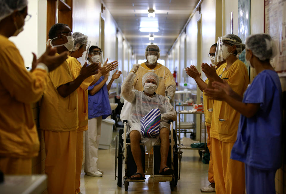 Lauro Riff Viegas, 69, gestures as he leaves the Nossa Senhora da Conceicao Hospital, after being treated for the coronavirus disease (COVID-19) and discharged, in Porto Alegre, Brazil, April 27, 2020. REUTERS/Diego Vara     TPX IMAGES OF THE DAY